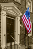 Fototapeta  - American flag in front of typical american houses