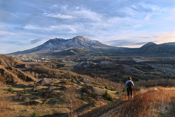 Wall Mural - Woman walking  on ridge to Mount St Helens. Boundary Trail in Mt St Helens National Volcanic Monument. Washington. United States of America