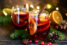 Red Spicy Christmas Mulled Wine With Cranberries, Apple And Orange.