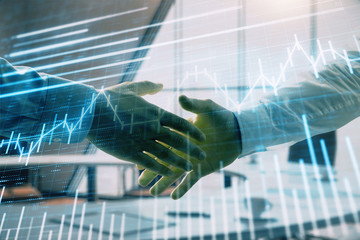 Multi exposure of financial graph on office background with two businessmen handshake. Concept of success in business