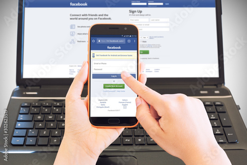Cagliari Italy 30 05 17 Smartphone On Female Hands Browsing Facebook Login Page And In Background A Portable Computer With The Same Site This Is An Illustrative Editorial Image Stock Photo Adobe Stock Cagliari Italy 30 05 17 Smartphone On Female Hands Browsing Facebook Login Page And In Background A Portable Computer With The Same Site This Is An Illustrative Editorial Image Stock Photo Adobe Stock