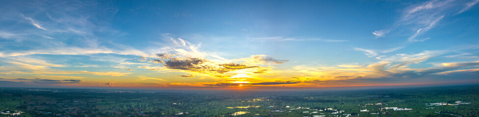 Wall Mural - panorama top view aerial photo from flying drone over village in thailand.cumulus sunset clouds with
