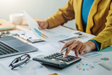 .Business woman working in finance and accounting Analyze financial budget in the office