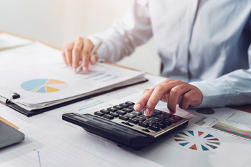 Poster - .Business woman working in finance and accounting Analyze financial budget in the office
