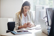 © LStockStudio - Businesswoman Using a Mobile Phone