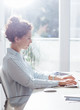© LStockStudio - Businesswoman Working on a Desktop Computer