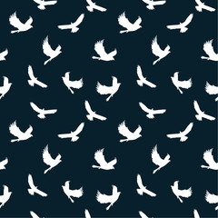 Naklejka na meble  Seamless pattern: white silhouettes of birds on a dark background. vector. illustration