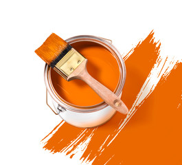 Orange paint tin can with brush on top on a white background with orange strokes