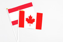 Canada And French Polynesia Stick Flags On White Background. High Quality Fabric, Miniature National Flag. Peaceful Global Concept.White Floor For Copy Space.