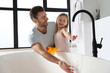 © New Africa - Father with his cute little daughter filling tub in bathroom