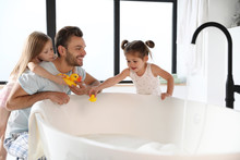 Young Father With Little Daughters In Bathroom
