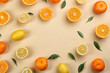 Flat lay composition with tangerines and different citrus fruits on beige background. Space for text