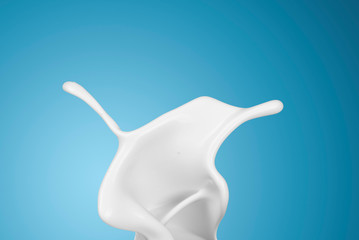 Sticker - milk or white liquid splash on blue background.