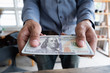 © Jakkapant - Man handed dollar bills to you, American money in hand, Cash in hands, Income and Business concept.