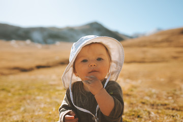 Baby girl traveling in mountains family active lifestyle cute infant child vacations outdoor kid portrait