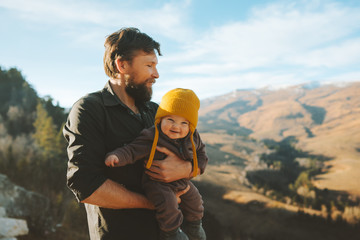 Wall Mural - Father walking with baby daughter in mountains travel family adventure lifestyle vacations dad with child activity outdoor
