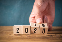 Hand Flipping Cubes With Year 2019 To 2020