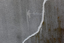Concrete Wall With Crack Repaired With White Concrete Patching Putty