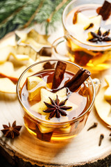 Sticker - Hot drink for New Year, Christmas or autumn holidays. Mulled cider or spiced tea or mulled white wine with lemon, apples, cinnamon, anise, cloves.