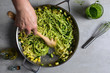 © Andrew Scrivani - Overhead view of spaghetti with zucchini, parsley pesto and bottarga