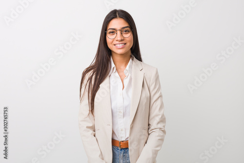 Cuadros en Lienzo Young business arab woman isolated against a white background happy, smiling and cheerful