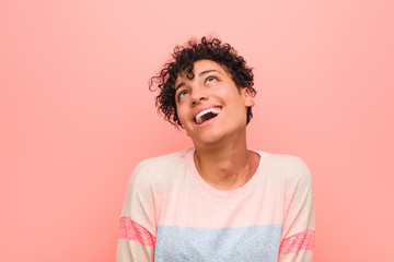 Wall Mural - Young mixed african american teenager woman relaxed and happy laughing, neck stretched showing teeth.