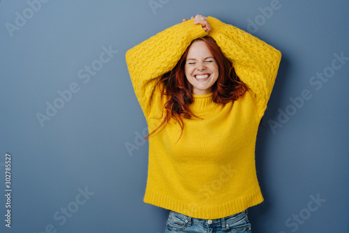 Cute charismatic young woman grinning happily Tableau sur Toile