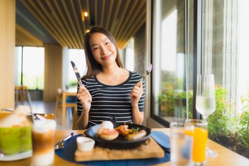 Portrait beautiful young asian women smile happy in restaurant and coffee shop cafe