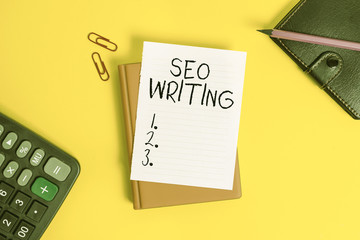 Poster - Text sign showing Seo Writing. Business photo showcasing grabbing the attention of the search engines using specific word Pile of empty papers with copy space on the table