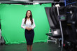 © New Africa - Presenter and video camera operator working in studio. News broadcasting