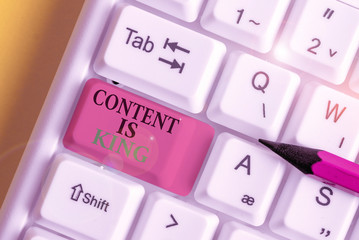 Poster - Conceptual hand writing showing Content Is King. Concept meaning words what sells products and provide good marketing White pc keyboard with note paper above the white background