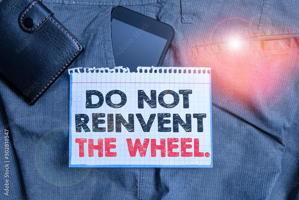 Writing note showing Do Not Reinvent The Wheel. Business concept for stop duplicating a basic method previously done Smartphone device inside trousers front pocket with wallet - obrazy, fototapety, plakaty 