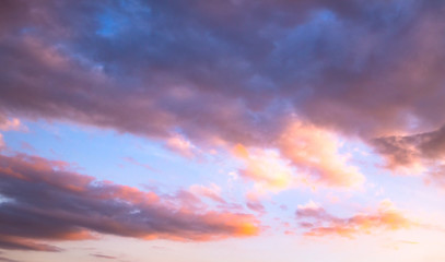 Wall Mural - Dramatic autumn sunset with twilight color sky and clouds background