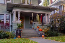 House Porch With Halloween Pumkins On Steps