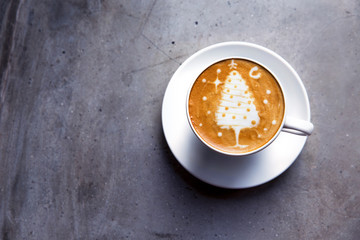 Sticker - Tasty cappuccino with Christmas tree latte art on grey concrete background.