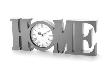 Stylish decor in shape of word HOME with clock on white background