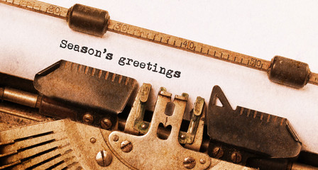 Wall Mural - Season's greetings, written on an old typewriter