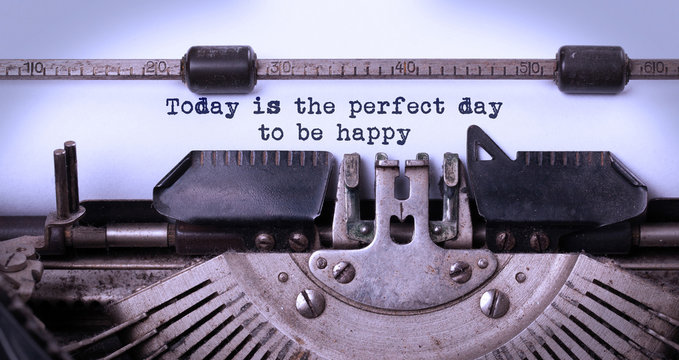 Today is the perfect day to be happy, written on an old typewriter