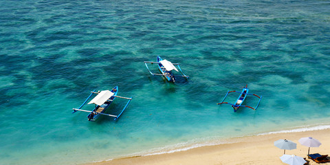 Wall Mural -  boat on white sand beach in bali -indonesia