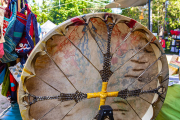 Wall Mural - Sacred Native American drum, close up picture outdoors during a spiritual gathering, traditional music instrument