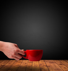 Wall Mural - Cup of drink on wooden table with dark background