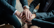 © May Chanikran - Teamwork of business people stacking hands together in the meeting.