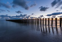 Sunset Over The Pier Of The Ocean In Westkapelle, Zeeland, Netherlands