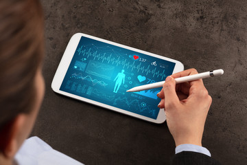 Wall Mural - Business woman making healthy analysis on tablet