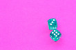© dorotaam - Gambling dices on a pink background.