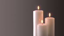 Three Burning Candles On Gray Degrading Background