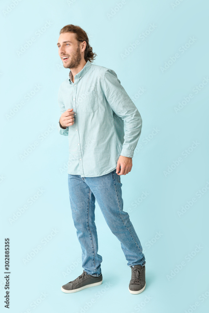 Portrait of handsome man on color background