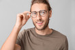 © Pixel-Shot - Portrait of handsome man on grey background