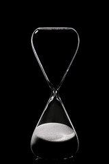 Crystal hourglass on dark background