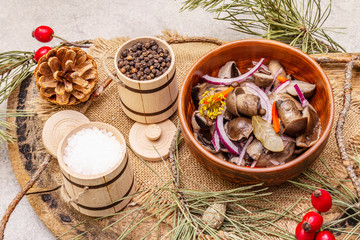 Wall Mural - Pickled (fermented) mushrooms. Traditional New Year (Christmas) snack. Festive table cutlery setting